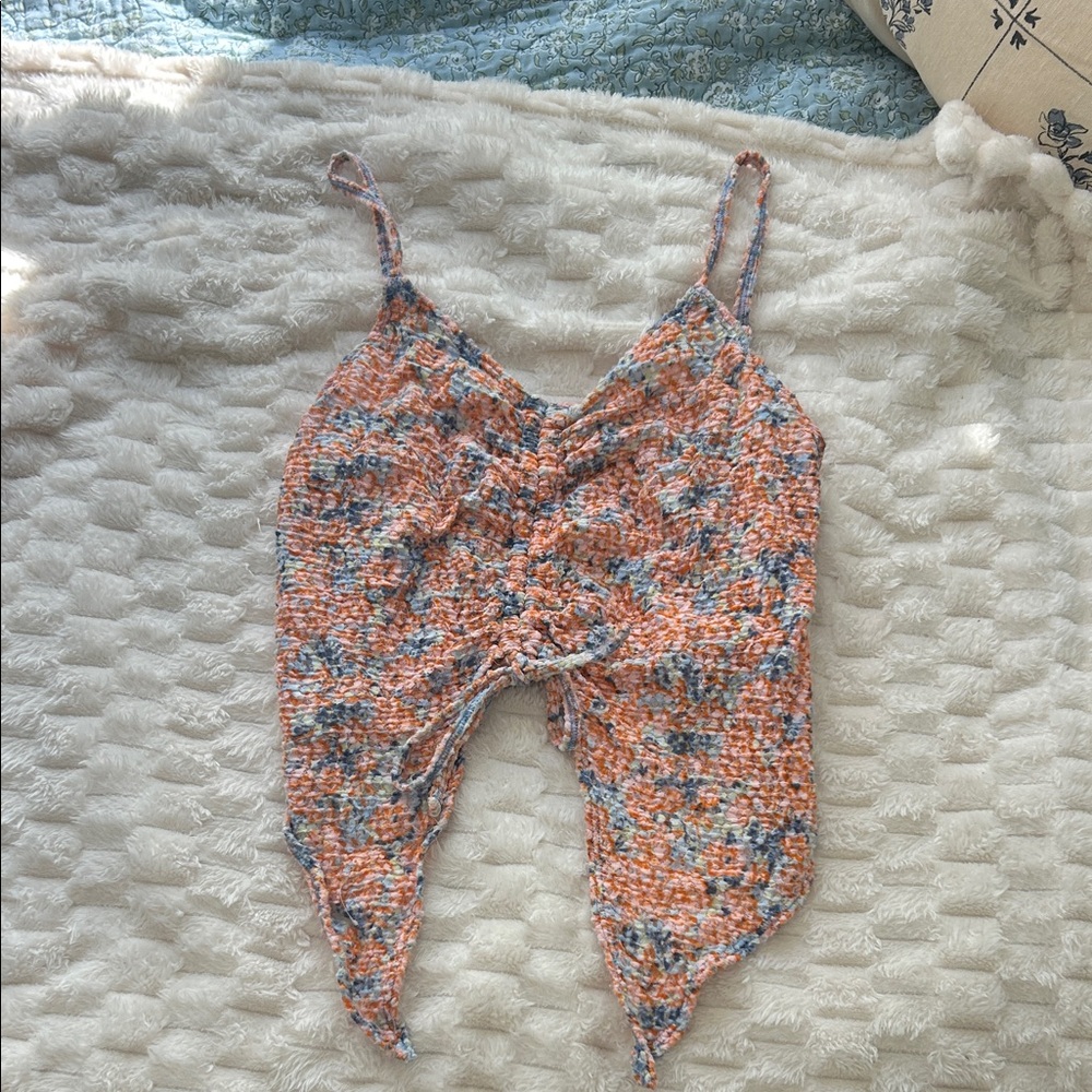 Multicolor tank top with adjustable center cinching.